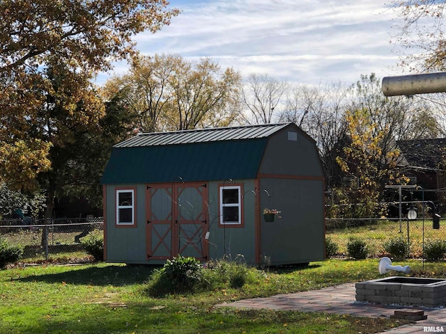 view of outbuilding featuring a yard