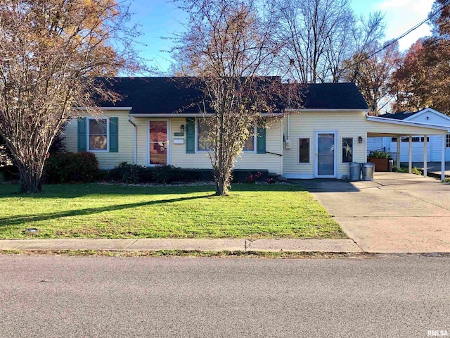 view of front facade featuring a carport and a front yard