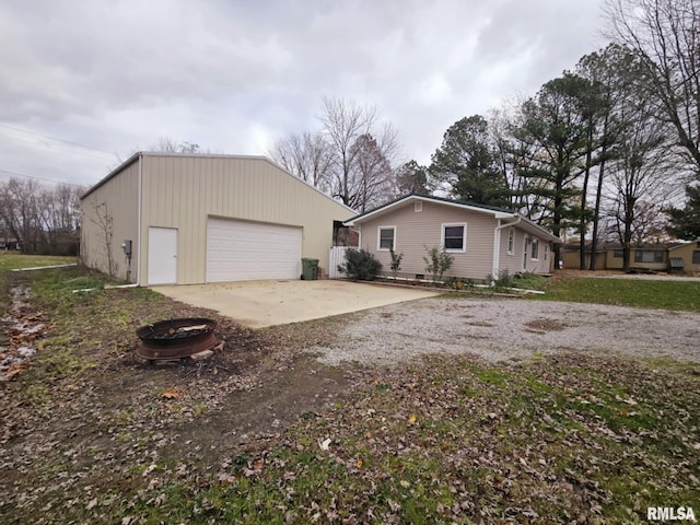 view of front facade featuring an outbuilding and a garage