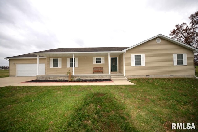 ranch-style house featuring a front lawn, covered porch, and a garage