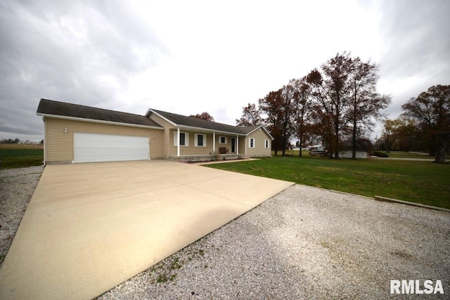 ranch-style home featuring a garage and a front lawn