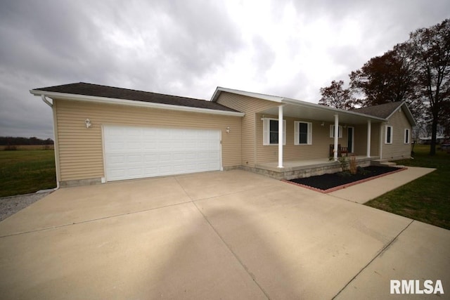 view of front of house featuring covered porch and a garage