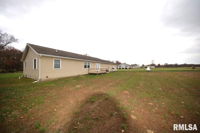 exterior space featuring a yard and a wooden deck