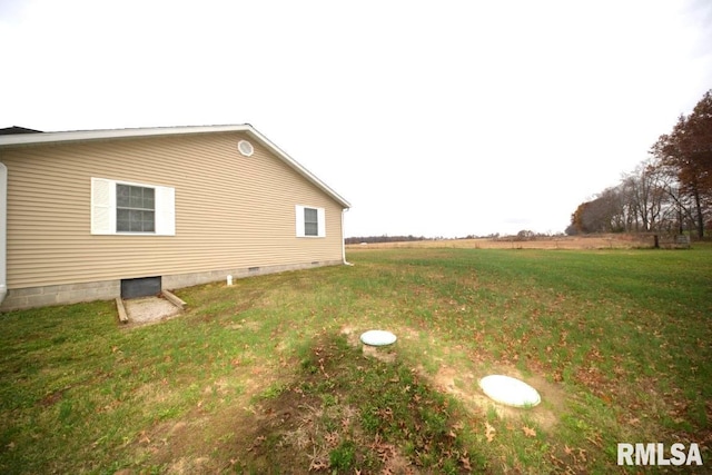 view of home's exterior with a yard