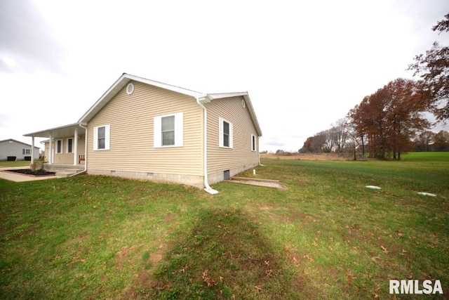 view of home's exterior with a yard