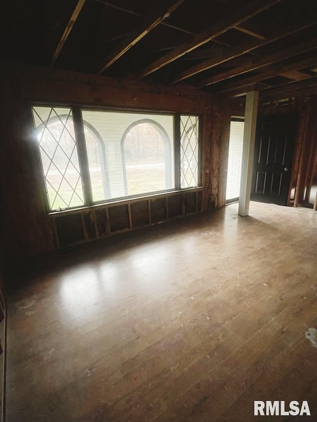 unfurnished room featuring wood-type flooring