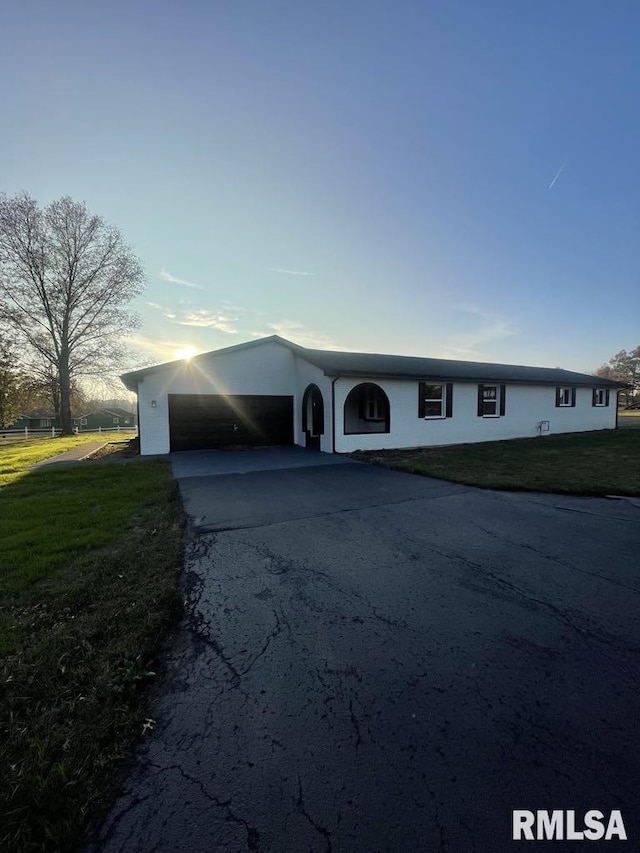 7837 State Highway 37, Benton, IL 62812 - view of front of house featuring driveway, a front yard, a carport, and stucco siding