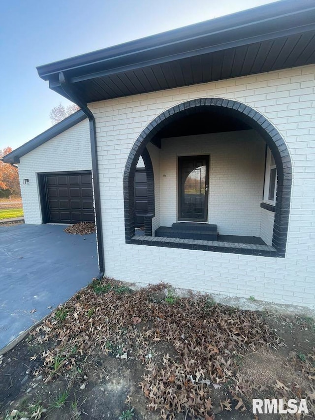 view of side of home with a garage