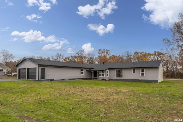 7837 State Highway 37, Benton, IL 62812 - back of house featuring an attached garage, a yard, and asphalt driveway