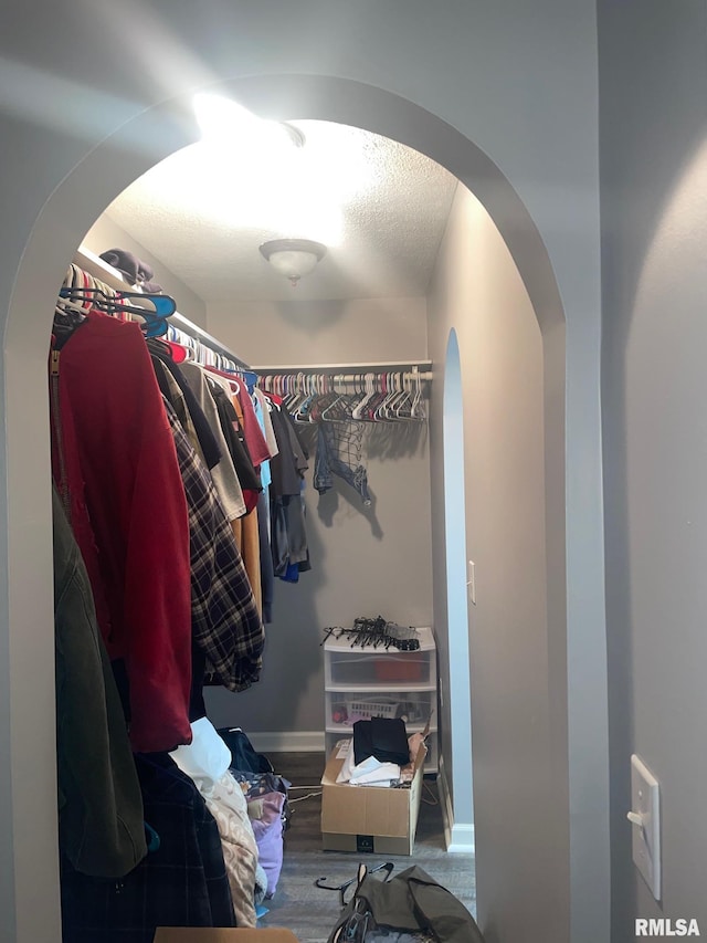 spacious closet featuring hardwood / wood-style floors