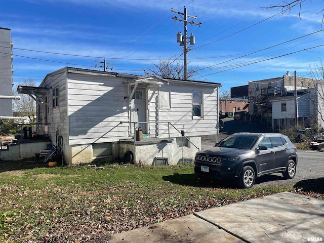 view of home's exterior with a yard