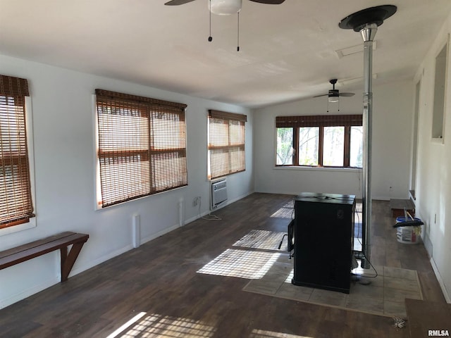 unfurnished living room featuring ceiling fan, dark hardwood / wood-style flooring, and lofted ceiling