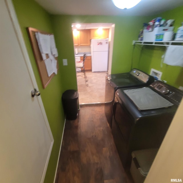 washroom featuring washer and dryer and dark hardwood / wood-style flooring