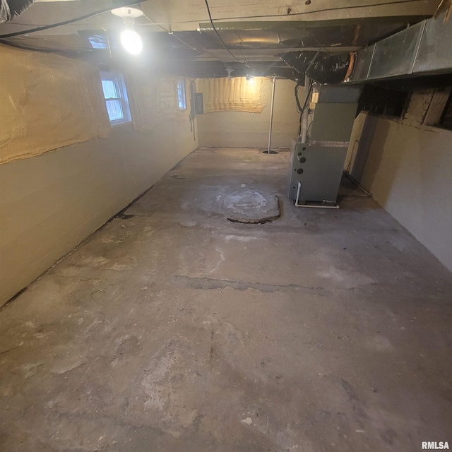 basement featuring heating unit