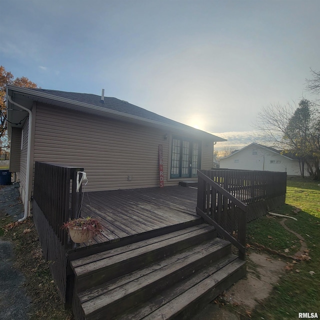 rear view of house featuring a wooden deck