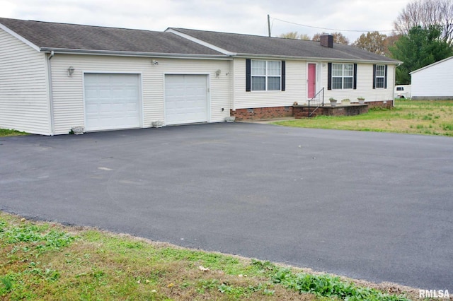 single story home featuring a garage