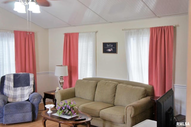 living room featuring hardwood / wood-style floors, plenty of natural light, and ceiling fan