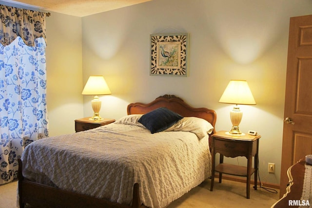 bedroom featuring light carpet