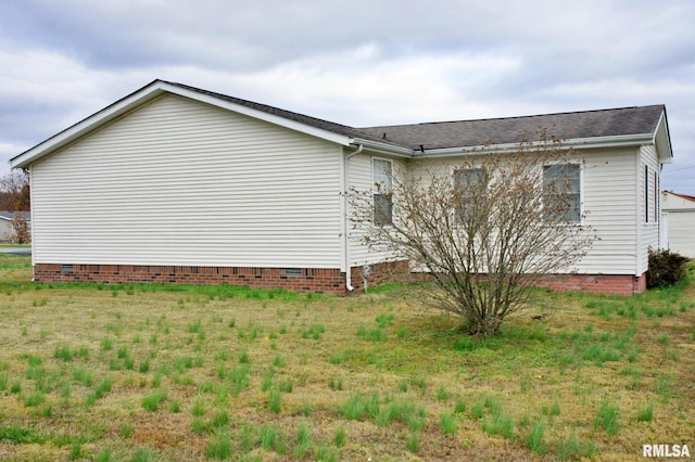 view of home's exterior featuring a yard