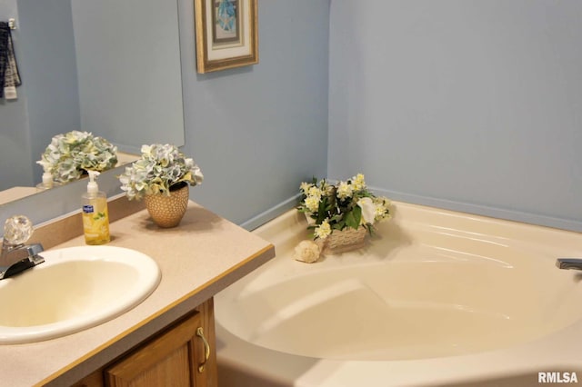 bathroom featuring a bathing tub and vanity