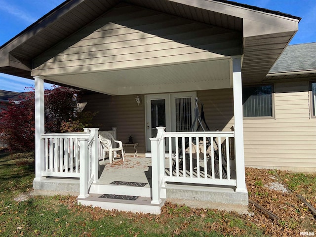 back of property featuring a porch