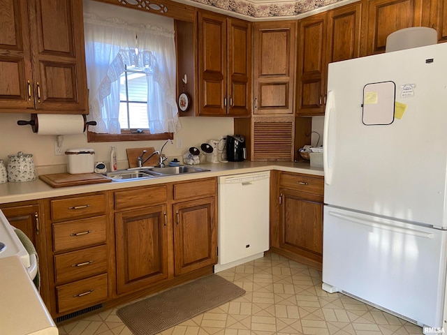 kitchen with white appliances and sink