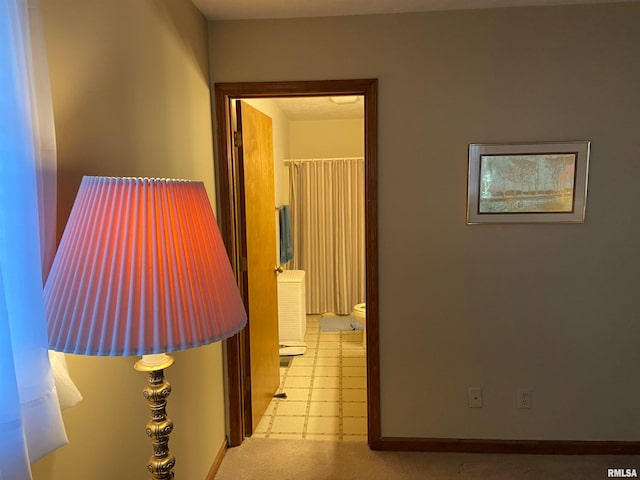 hallway with light tile patterned floors