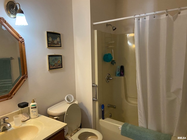 full bathroom featuring vanity, toilet, and shower / tub combo