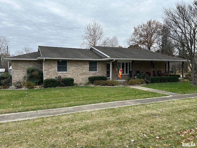 ranch-style home with a front yard and a porch