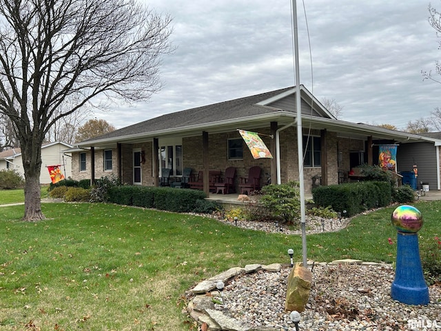 ranch-style home with a porch and a front yard