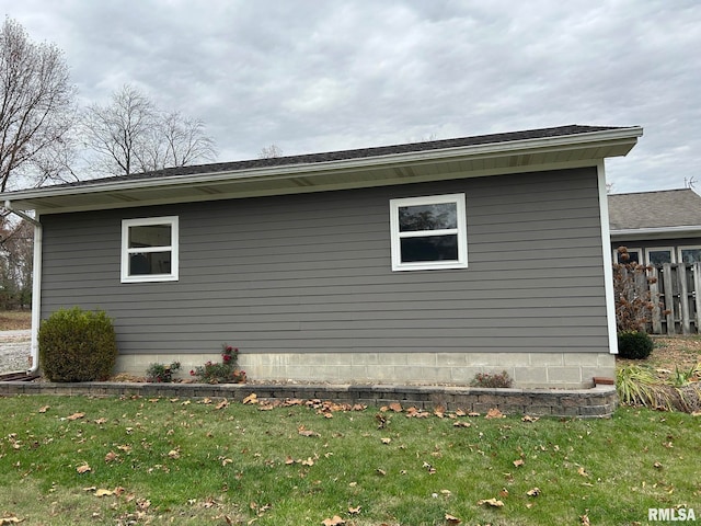 view of side of property with a yard