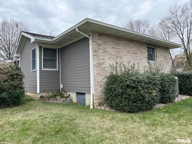 view of home's exterior featuring a lawn