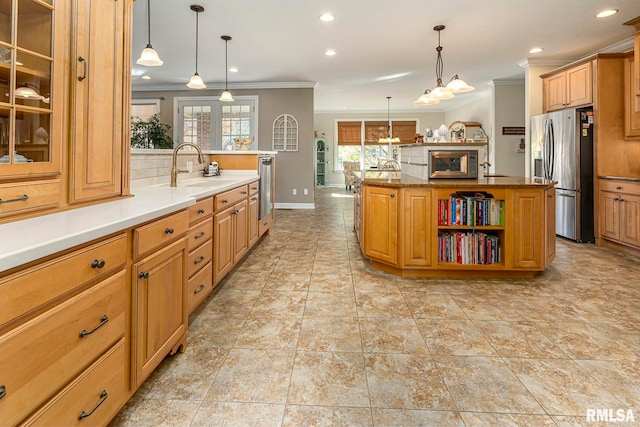 kitchen featuring pendant lighting, a kitchen island with sink, sink, ornamental molding, and stainless steel fridge with ice dispenser