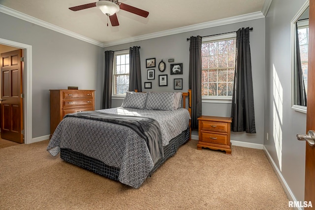 bedroom with multiple windows, ceiling fan, crown molding, and light carpet