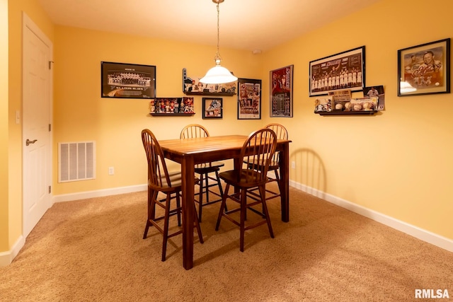 dining area with carpet flooring