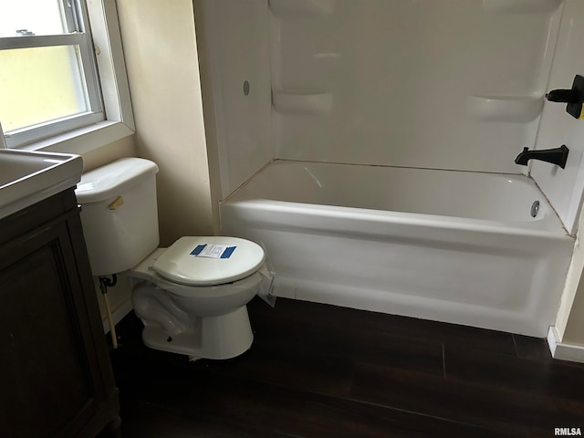 full bathroom with vanity, wood-type flooring, tub / shower combination, and toilet