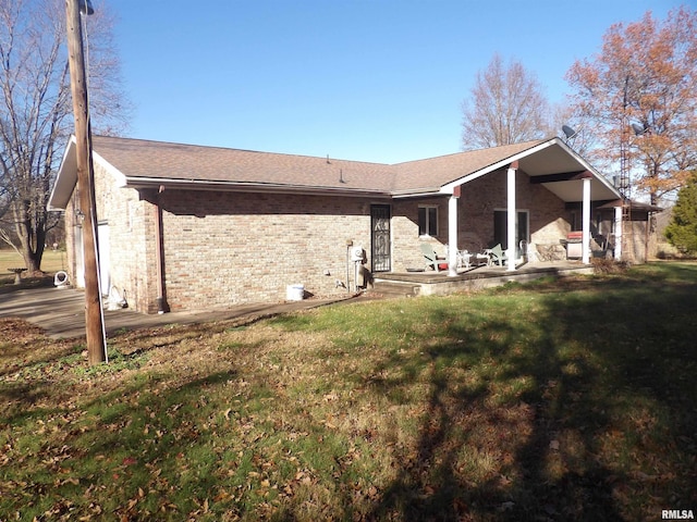 rear view of house with a lawn