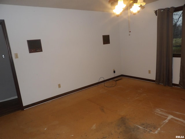 unfurnished room featuring electric panel and ceiling fan