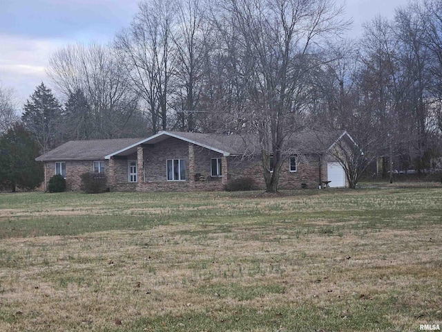 ranch-style house with a front lawn and a garage