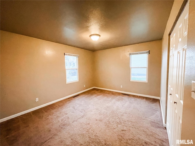 view of carpeted spare room