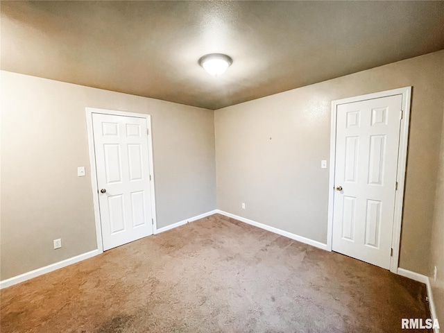 spare room featuring carpet floors