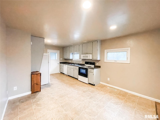 kitchen with white appliances and sink