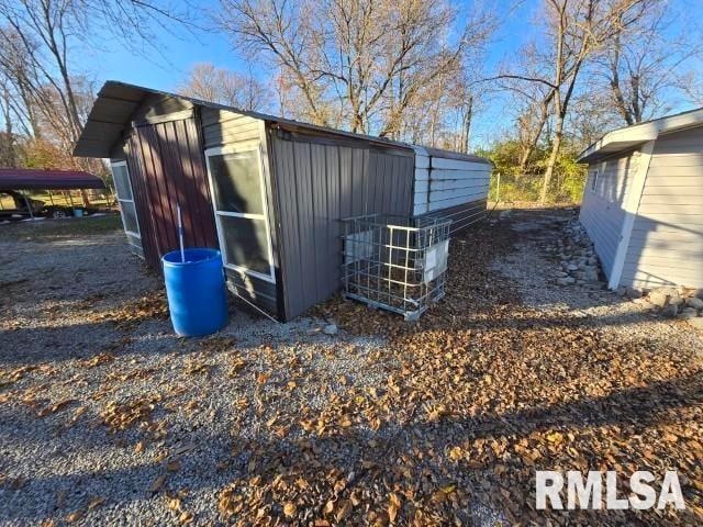 view of outdoor structure with a carport