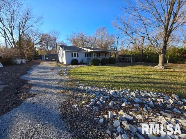 ranch-style home with a front yard