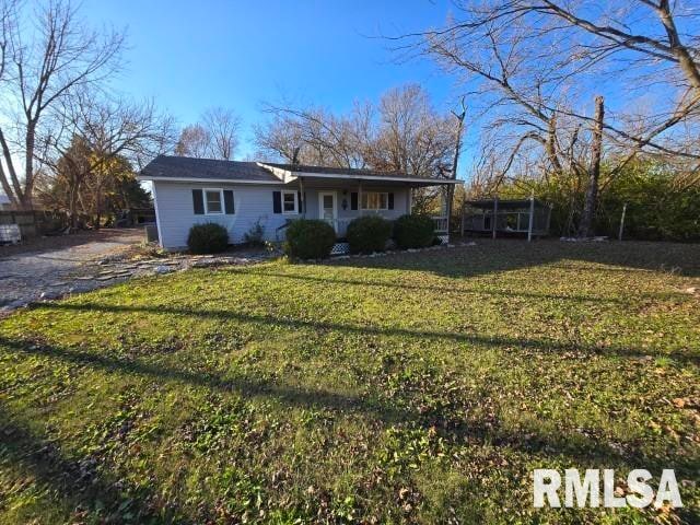 ranch-style home with a front lawn