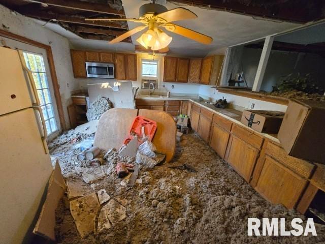 kitchen featuring ceiling fan and white refrigerator