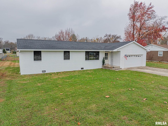 ranch-style house featuring a front lawn and a garage