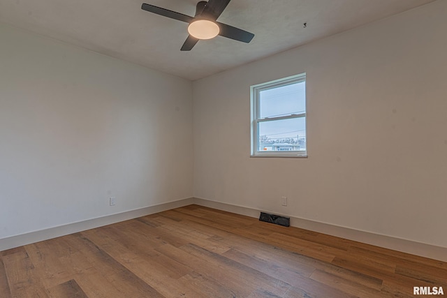 spare room with light hardwood / wood-style flooring and ceiling fan