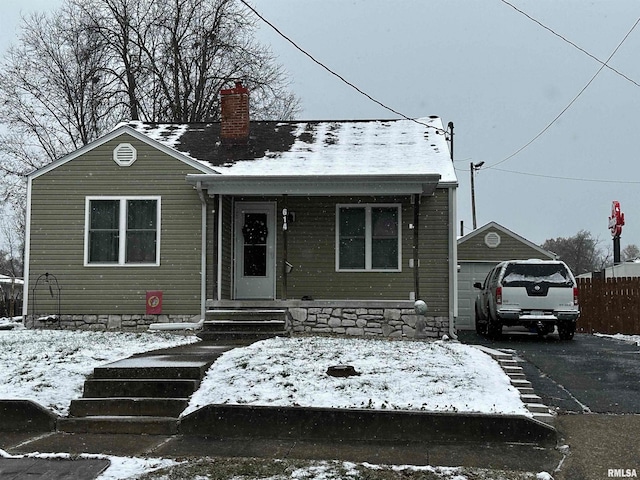 view of front of house featuring an outbuilding and a garage