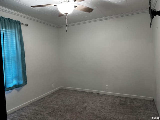 carpeted spare room with ceiling fan and crown molding